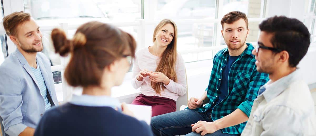 A circle of individuals participating in group therapy, symbolizing support structure and long-term treatment essential for staying sober after detox.